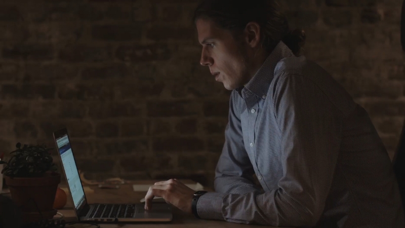 Person reviewin and updatin blog content on a laptop to maintain trust and accuracy