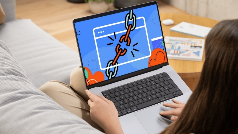 Person review internal links on a laptop after a site redesign that broke navigation structure