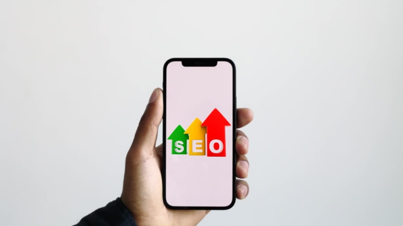 Mobile First SEO Rules image shows a phone held in a hand with colorful SEO arrows on the screen